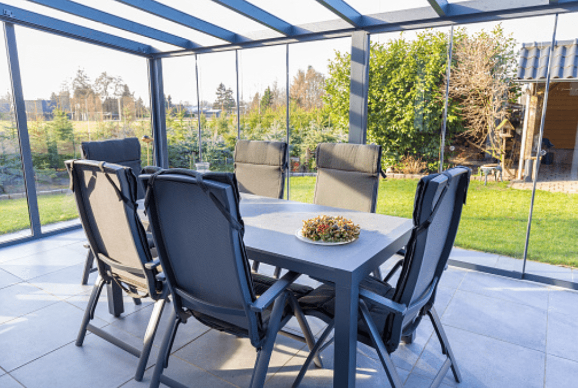 Glass Sunroom Enclosures and Solariums Invite Warmth Year-Round